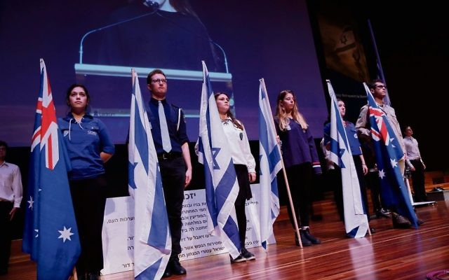 Zionist youth movement and Australasian Union of Jewish Students flag
bearers at Tuesday’s Yom Hazikaron ceremony in Melbourne. Photo: Peter Haskin Zionist youth movement and Australasian Union of Jewish Students flag
bearers at Tuesday’s Yom Hazikaron ceremony in Melbourne. Photo: Peter Haskin
