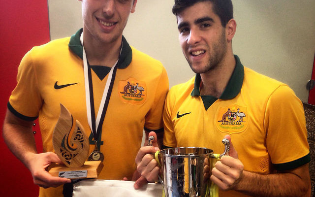 Futsalroo teammates, Trans-Tasman MVP Jordan Mundell (left) and Jarrod Basger,
holding the series cup. Futsalroo teammates, Trans-Tasman MVP Jordan Mundell (left) and Jarrod Basger,
holding the series cup.