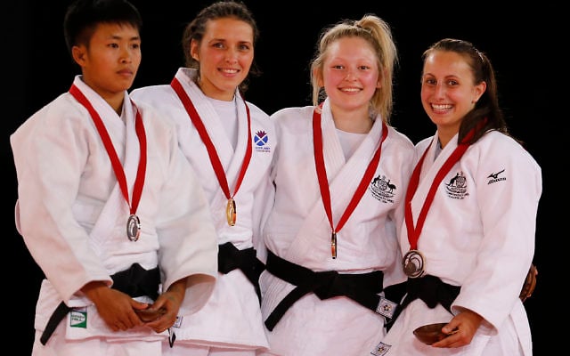 Amy Meyer (right) pictured with fellow judo medal-winners in the women’s under-48kg category in Glasgow, Scotland.
Photo: AP Photo/Frank Augstein