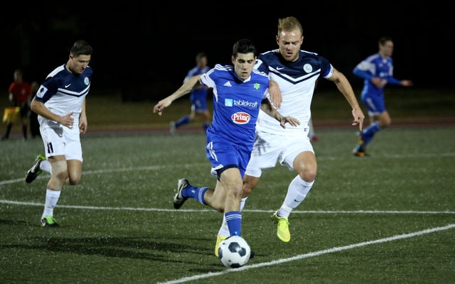 Hakoah’s Jarrod Basger manoeuvres past Palm Beach captain Justyn McKay in their FFA Cup round of 32 clash. Photo: Noel Kessel