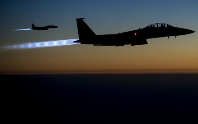 A pair of US Air Force F-15E Strike Eagles fly over northern Iraq after conducting airstrikes in Syria.