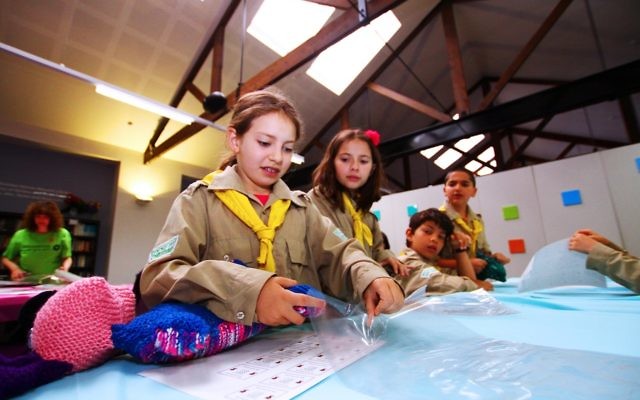 Members of the Israeli scouts, Tzofim, help out KOGO at Kehilat Nitzan packing gifts for children fleeing domestic violence.
Photo: Peter Haskin Members of the Israeli scouts, Tzofim, help out KOGO at Kehilat Nitzan packing gifts for children fleeing domestic violence.
Photo: Peter Haskin