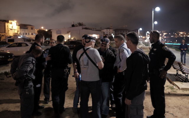 Israeli security and medics at the scene of a stabbing attack where one person was murdered and nine others were wounded in Jaffa Port, Tel Aviv on March 8, 2016. Photo by Tomer Neuberg/Flash90