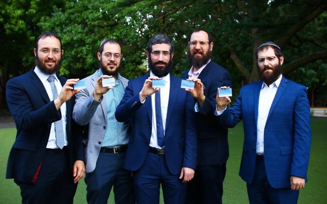 From left: Rabbi Daniel Rabin, Rabbi Chaim Cowen, Rabbi Yaakov Glasman, Rabbi Menachem Wolf and Rabbi Velly Slavin showing off their HODS cards. Photo: Peter Haskin. From left: Rabbi Daniel Rabin, Rabbi Chaim Cowen, Rabbi Yaakov Glasman, Rabbi Menachem Wolf and Rabbi Velly Slavin showing off their HODS cards. Photo: Peter Haskin.