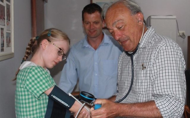 Labor candidate for Macarthur, Dr Mike Freelander, treating a young patient. Labor candidate for Macarthur, Dr Mike Freelander, treating a young patient.