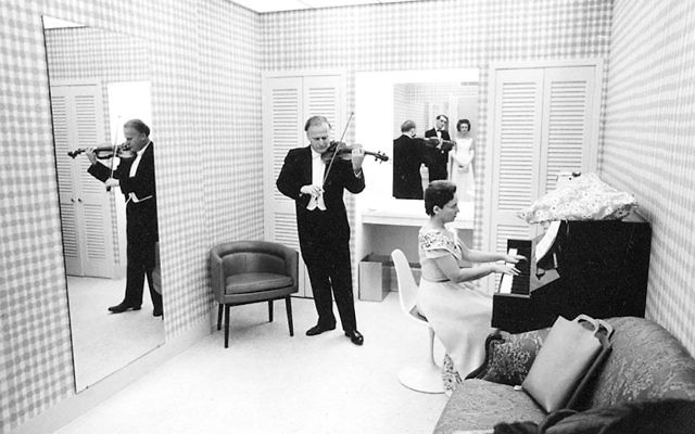 Yehudi Menuhin and his sister Hephzibah rehearse backstage. Yehudi Menuhin and his sister Hephzibah rehearse backstage.