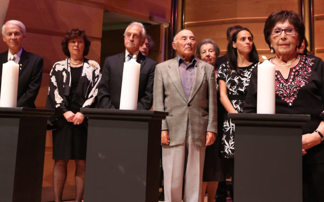 Lighting of the memorial candles at a past Yom Hashoah commemoration in Sydney. Photo: Giselle Haber Lighting of the memorial candles at a past Yom Hashoah commemoration in Sydney. Photo: Giselle Haber