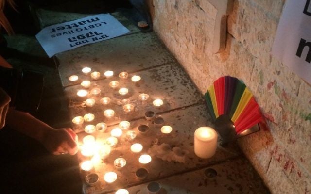 Lighting candles in Zion Square in memory of the Orlando victims. Lighting candles in Zion Square in memory of the Orlando victims.