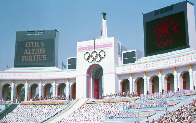 Olympic Torch Tower of the Los Angeles Coliseum during the opening ceremony of the 1984 Summer Olympics. Olympic Torch Tower of the Los Angeles Coliseum during the opening ceremony of the 1984 Summer Olympics.