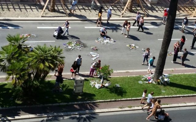 Gary and Sheila Esterman’s view of the Nice boulevard where 84 people were killed by a terrorist last week. Flowers have been left by family and friends of those killed. Gary and Sheila Esterman’s view of the Nice boulevard where 84 people were killed by a terrorist last week. Flowers have been left by family and friends of those killed.