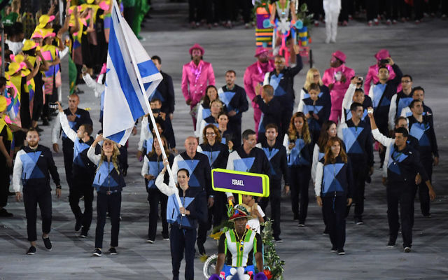 Israel's flagbearer Neta Rivkin leads her delegation during the opening ceremony of the Rio 2016 Olympic Games. (PEDRO UGARTE/AFP/Getty Images) Israel's flagbearer Neta Rivkin leads her delegation during the opening ceremony of the Rio 2016 Olympic Games. (PEDRO UGARTE/AFP/Getty Images)