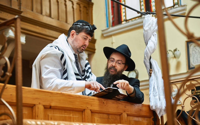 Former right-wing politician Csanad Szegedi in a synagogue with Rabbi Boruch Oberlander in Keep Quiet. Former right-wing politician Csanad Szegedi in a synagogue with Rabbi Boruch Oberlander in Keep Quiet.