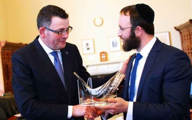 Premier Daniel Andrews (left) is presented with a shofar from Rabbi Rabin. Premier Daniel Andrews (left) is presented with a shofar from Rabbi Rabin.