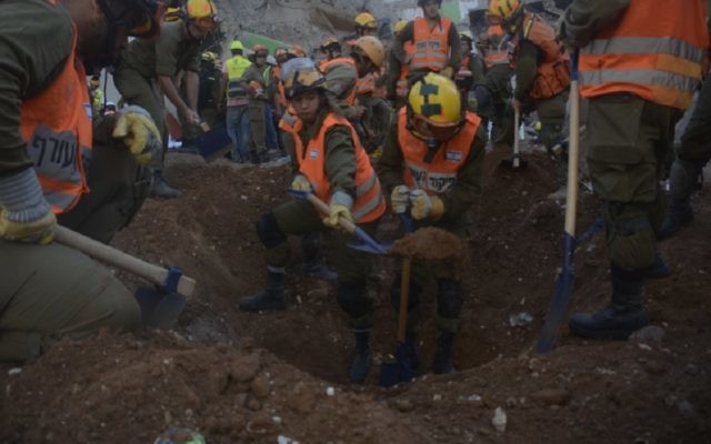 Rescue personnel digging in the search for missing workers at a construction site collapse in Tel Aviv, Sept. 5, 2016. (JTA) Rescue personnel digging in the search for missing workers at a construction site collapse in Tel Aviv, Sept. 5, 2016. (JTA)