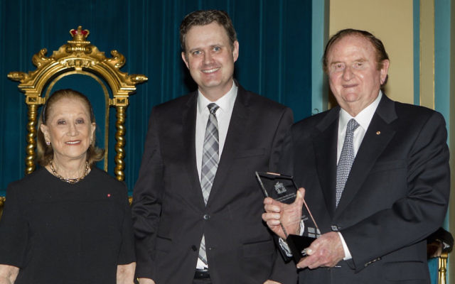 The Gandels receiving their award.