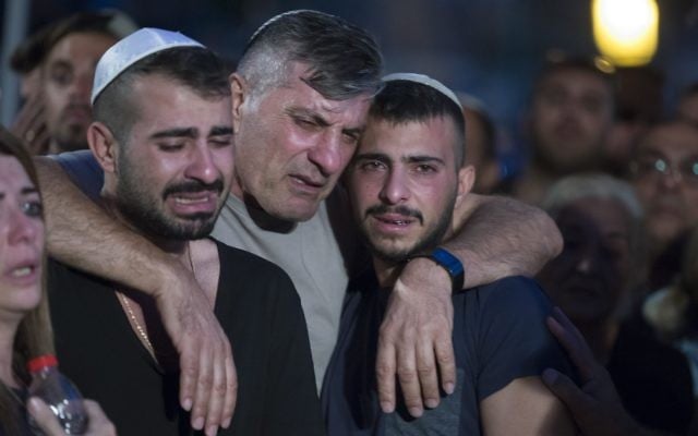 he father and brother of Israeli policeman 1st Sgt. Yosef Kirme mourning at the funeral on Mt. Herzl Military Cemetery in Jerusalem for burial 09 October 2016. Kirma was killed earlier today in a shoot out with a Palestinian from the Jerusalem area who opened fire at passenger cars in East Jerusalem, killing two people before he was killed. The Palestinian attacker, according to police, was due to start serving a jail term today for assaulting an Israeli police officer. EPA/JIM HOLLANDER he father and brother of Israeli policeman 1st Sgt. Yosef Kirme mourning at the funeral on Mt. Herzl Military Cemetery in Jerusalem for burial 09 October 2016. Kirma was killed earlier today in a shoot out with a Palestinian from the Jerusalem area who opened fire at passenger cars in East Jerusalem, killing two people before he was killed. The Palestinian attacker, according to police, was due to start serving a jail term today for assaulting an Israeli police officer. EPA/JIM HOLLANDER