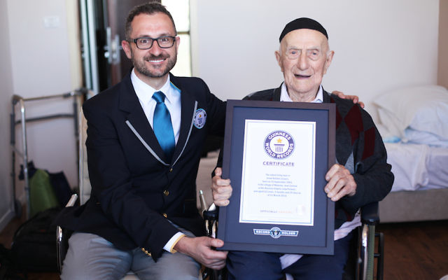 Marco Frigatti, Head of Records for Guinness World Records, presents Israel Kristal his certificate of achievement for Oldest living man on 11th March 2016, Haifa, Israel. Picture credit: Dvir Rosen/Guinness World Records Marco Frigatti, Head of Records for Guinness World Records, presents Israel Kristal his certificate of achievement for Oldest living man on 11th March 2016, Haifa, Israel. Picture credit: Dvir Rosen/Guinness World Records