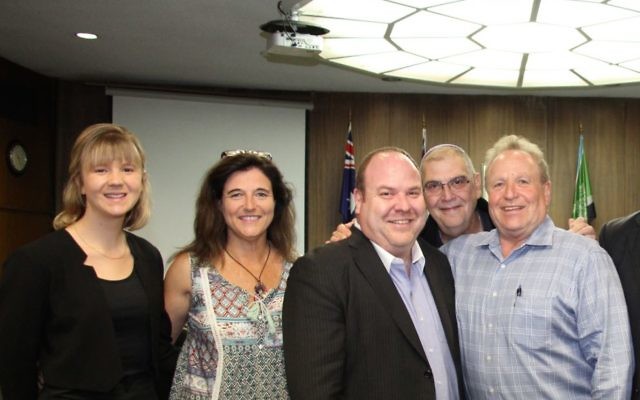 All smiles: Yair Miller (centre) with other Jewish members of the St Ives community, directly after Ku-ring-gai Council's decision to approve the St Ives Eruv. Photo: Shane Desiatnik All smiles: Yair Miller (centre) with other Jewish members of the St Ives community, directly after Ku-ring-gai Council's decision to approve the St Ives Eruv. Photo: Shane Desiatnik
