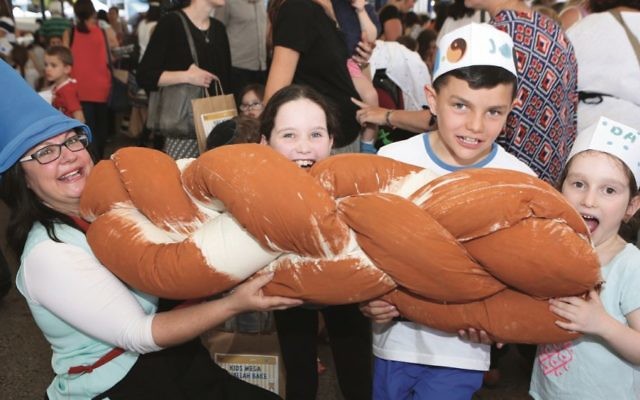From left: Laya Slavin, Tessa Resnick, Jono Amoils and Davina Resnick at last year’s Challah Bake.
Photo: Giselle Haber From left: Laya Slavin, Tessa Resnick, Jono Amoils and Davina Resnick at last year’s Challah Bake.
Photo: Giselle Haber