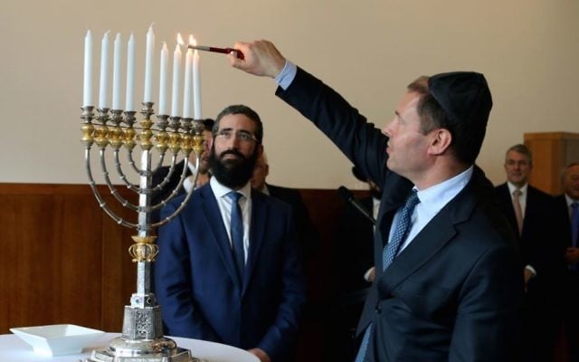 Josh Frydenberg MP lights an historic chanukiah at a Chanukah reception at Parliament House, Canberra. Josh Frydenberg MP lights an historic chanukiah at a Chanukah reception at Parliament House, Canberra.