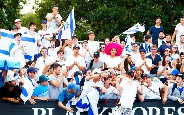 Israeli tennis player Dudi Sela surrounded by fans dressed in blue and white at the Australian Open following his first round win. Photo: Peter Haskin Israeli tennis player Dudi Sela surrounded by fans dressed in blue and white at the Australian Open following his first round win. Photo: Peter Haskin