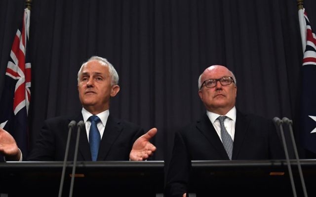 PM Malcolm Turnbull and Attorney-General George Brandis discussing the proposed amendment to Section 18C on Tuesday. Photo: AAP Image/Sam Mooy PM Malcolm Turnbull and Attorney-General George Brandis discussing the proposed amendment to Section 18C on Tuesday. Photo: AAP Image/Sam Mooy