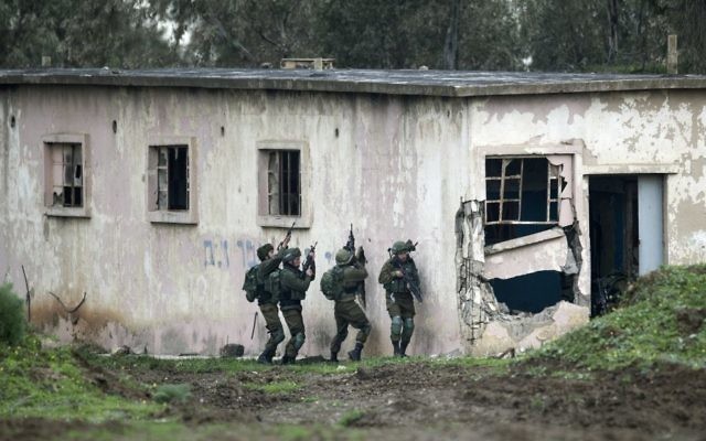 Israeli soldiers taking part in a military training exercise in the Golan Heights on Monday. Photo: EPA/Atef Safadi