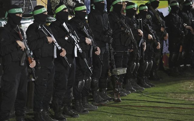 Fighters from Hamas's Ezz-Al Din Al Qassam Brigades at Monday's memorial service for Mazen Fuqaha. Photo: EPA/Mohammed Saber Fighters from Hamas's Ezz-Al Din Al Qassam Brigades at Monday's memorial service for Mazen Fuqaha. Photo: EPA/Mohammed Saber