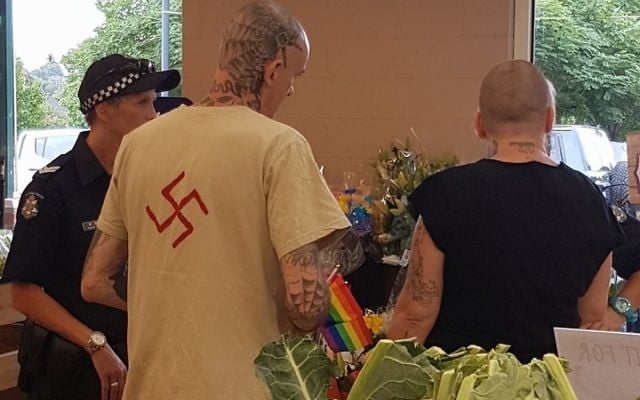 A man wearing a shirt with a swastika symbol is talked to by police at the 2017 Chill-out LGBTQI festival in Daylesford last weekend. A man wearing a shirt with a swastika symbol is talked to by police at the 2017 Chill-out LGBTQI festival in Daylesford last weekend.