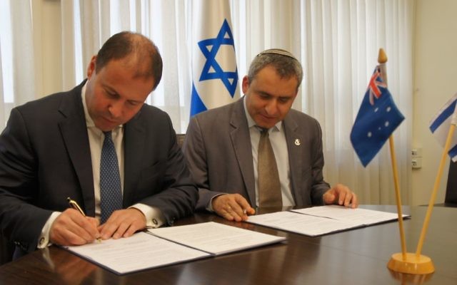 Josh Frydenberg and Ze’ev Elkin sign a joint declaration of intent on environmental cooperation. Josh Frydenberg and Ze’ev Elkin sign a joint declaration of intent on environmental cooperation.
