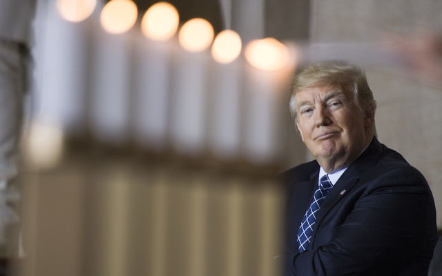 President Donald Trump watches the lighting of memorial candles during the annual Days of Remembrance Holocaust ceremony in the Capitol Rotunda on April 25, 2017. (Photo By Tom Williams/CQ Roll Call) President Donald Trump watches the lighting of memorial candles during the annual Days of Remembrance Holocaust ceremony in the Capitol Rotunda on April 25, 2017. (Photo By Tom Williams/CQ Roll Call)
