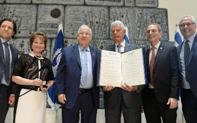 Jack Smorgon (holding the book) with President Reuven Rivlin and Keren Hayesod leaders. Jack Smorgon (holding the book) with President Reuven Rivlin and Keren Hayesod leaders.