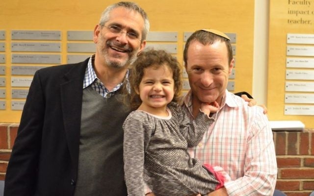Rabbi Steve Greenberg (left) with his partner Steven Goldstein and their daughter.