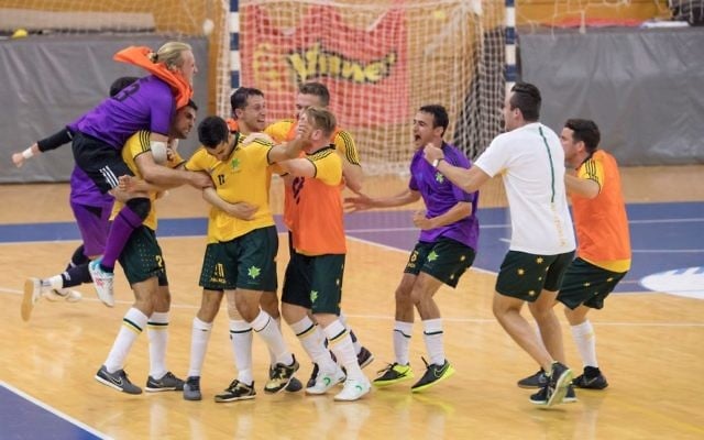 The Australian futsal team celebrating their last-minute victory over Brazil. Photo: Julie Kerbel The Australian futsal team celebrating their last-minute victory over Brazil. Photo: Julie Kerbel