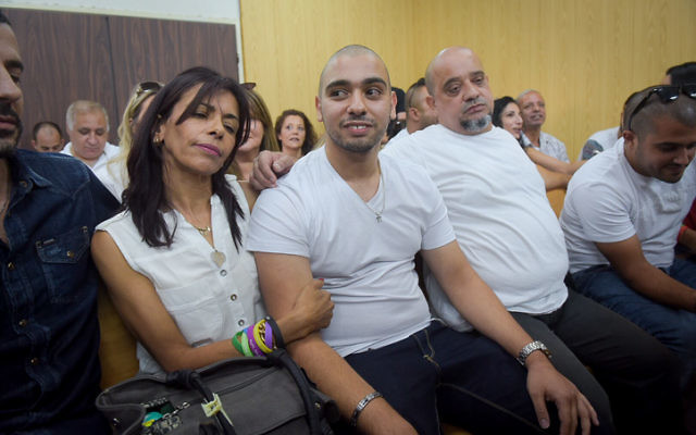 Elor Azaria sitting with his parents in a courtroom at a Tel Aviv military base on Sunday. Photo: Flash 90/Avshalom Sasoni/JTA. Elor Azaria sitting with his parents in a courtroom at a Tel Aviv military base on Sunday. Photo: Flash 90/Avshalom Sasoni/JTA.