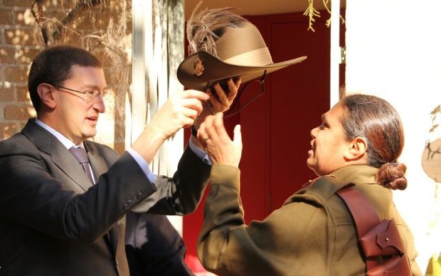 Julian Leeser presenting a replica slouch hat to Elsie Amamoo.
Photo: Shane Desiatnik Julian Leeser presenting a replica slouch hat to Elsie Amamoo.
Photo: Shane Desiatnik