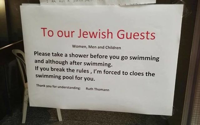 The sign at the hotel in Switzerland put up by manager Ruth Thomas, who has since apologised. The sign at the hotel in Switzerland put up by manager Ruth Thomas, who has since apologised.