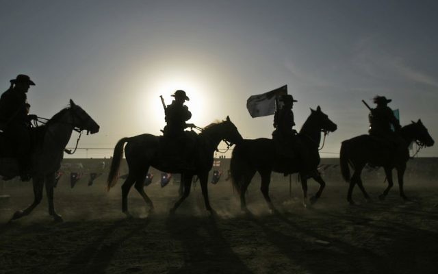 Re-enactment of the cavalry charge at the 90th anniversary commemorations in Beersheba. Photo: AP/Ariel Schalit Re-enactment of the cavalry charge at the 90th anniversary commemorations in Beersheba. Photo: AP/Ariel Schalit