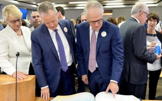 Counsel Assisting Gail Furness, Federal Opposition Leader Bill Shorten and Prime Minister Malcolm Turnbull look through the Message to Australia book containing hand-written letters from victims of child sexual abuse at the final sitting of the Royal Commission.
Photo: AAP Image/ Supplied by the Royal Commission
into Institutional Responses to Child Sexual Abuse Counsel Assisting Gail Furness, Federal Opposition Leader Bill Shorten and Prime Minister Malcolm Turnbull look through the Message to Australia book containing hand-written letters from victims of child sexual abuse at the final sitting of the Royal Commission.
Photo: AAP Image/ Supplied by the Royal Commission
into Institutional Responses to Child Sexual Abuse