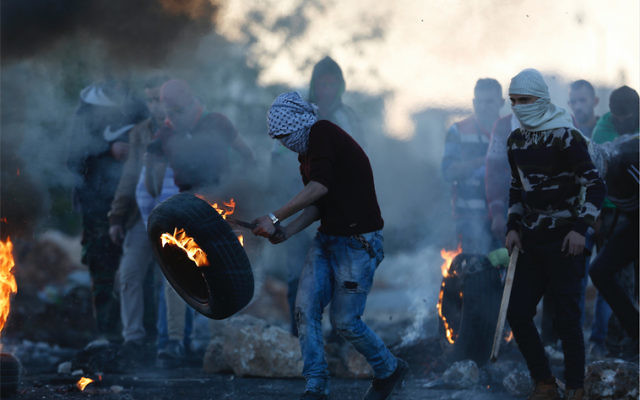 Palestinian protesters following the death of Ibrahim Abu Thurayya. Photo: AP Photo/Majdi Mohammed Palestinian protesters following the death of Ibrahim Abu Thurayya. Photo: AP Photo/Majdi Mohammed