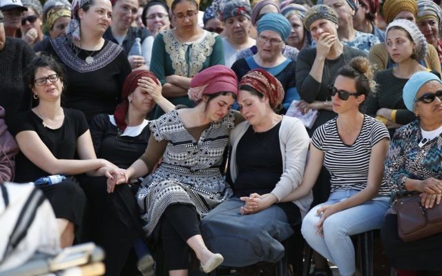 Family members mourn at the funeral of Adiel Coleman last Monday. Photo: EPA/Abir Sultan