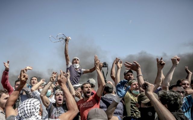 Palestinian protestors near the Gaza border on Monday. Photo: EPA/Mohammed Saber Palestinian protestors near the Gaza border on Monday. Photo: EPA/Mohammed Saber