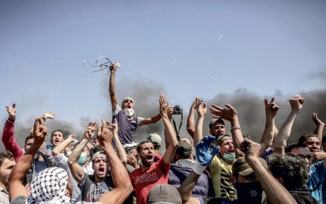 Palestinian protesters near the Gaza border on Monday. Photo: EPA/Mohammed Saber Palestinian protesters near the Gaza border on Monday. Photo: EPA/Mohammed Saber