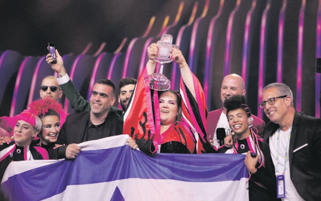 Netta and the Israeli team with the Eurovision trophy. Photo: Thomas Hanses Netta and the Israeli team with the Eurovision trophy. Photo: Thomas Hanses