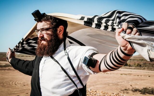 Rabbi Yossi Rodal prays in central Australia during a trip by Chabad of RARA which was filmed for a SBS documentary. Rabbi Yossi Rodal prays in central Australia during a trip by Chabad of RARA which was filmed for a SBS documentary.