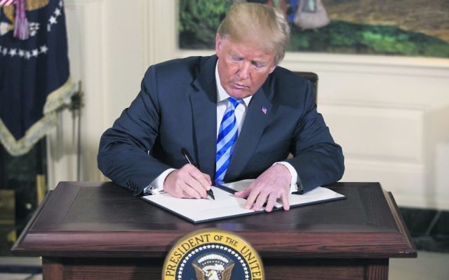 Donald Trump signing a national security presidential memorandum on Iran on Tuesday. Photo: EPA/Michael Reynolds Donald Trump signing a national security presidential memorandum on Iran on Tuesday. Photo: EPA/Michael Reynolds