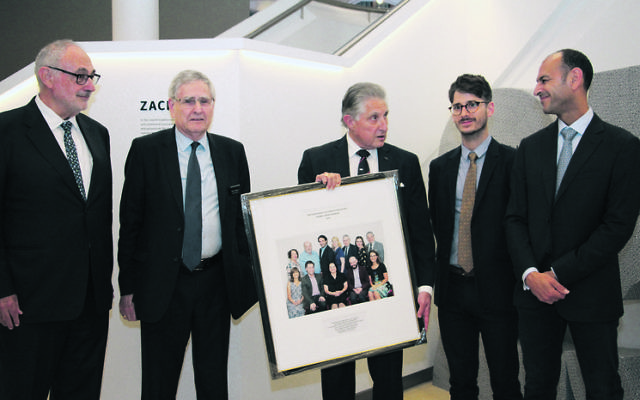 From left: Gus Lehrer, Norman Selingman and Robert Schneider from the SJM presenting a framed photograph to relatives of Isaac and Susan Wakil, Adam Lippmann and David Khedoori. Photo: Shane Desiatnik From left: Gus Lehrer, Norman Selingman and Robert Schneider from the SJM presenting a framed photograph to relatives of Isaac and Susan Wakil, Adam Lippmann and David Khedoori. Photo: Shane Desiatnik