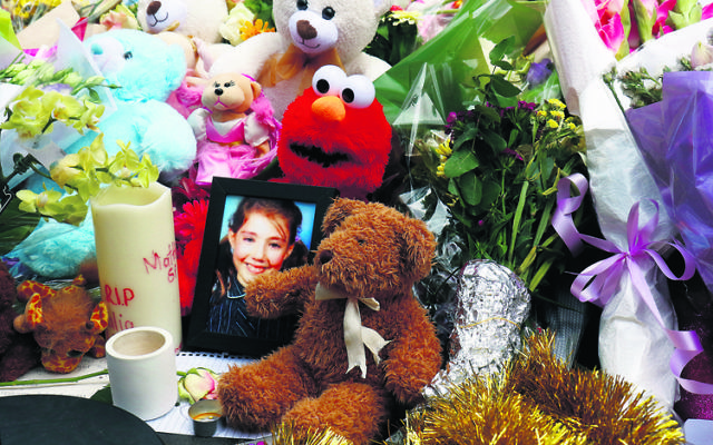 A photo of Thalia amid the floral tributes at the site of the Bourke Street tragedy last year. Photo: Peter Haskin A photo of Thalia amid the floral tributes at the site of the Bourke Street tragedy last year. Photo: Peter Haskin