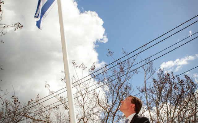 Dvir Abramovich raises Israel's flag at St Kilda Town Hall. Photo: Sav Schulman Dvir Abramovich raises Israel's flag at St Kilda Town Hall. Photo: Sav Schulman
