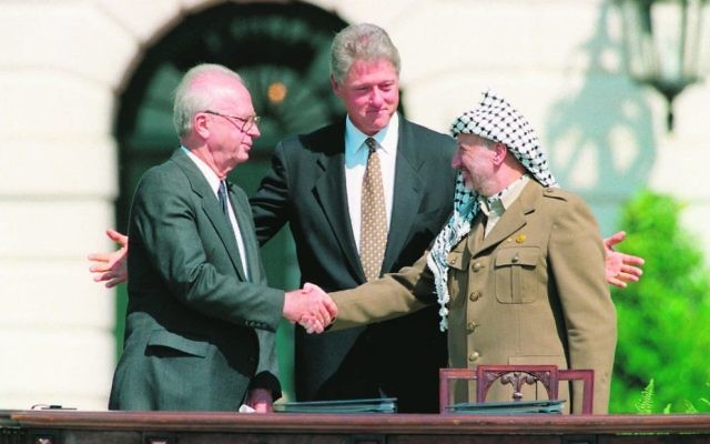 President Bill Clinton (centre), presiding over ceremonies marking the signing of the 1993 peace accord between Israeli Prime Minister Yitzhak Rabin (left) and PLO chairman Yasser Arafat on September 13, 1993. Photo: AP Photo/Ron Edmonds President Bill Clinton (centre), presiding over ceremonies marking the signing of the 1993 peace accord between Israeli Prime Minister Yitzhak Rabin (left) and PLO chairman Yasser Arafat on September 13, 1993. Photo: AP Photo/Ron Edmonds